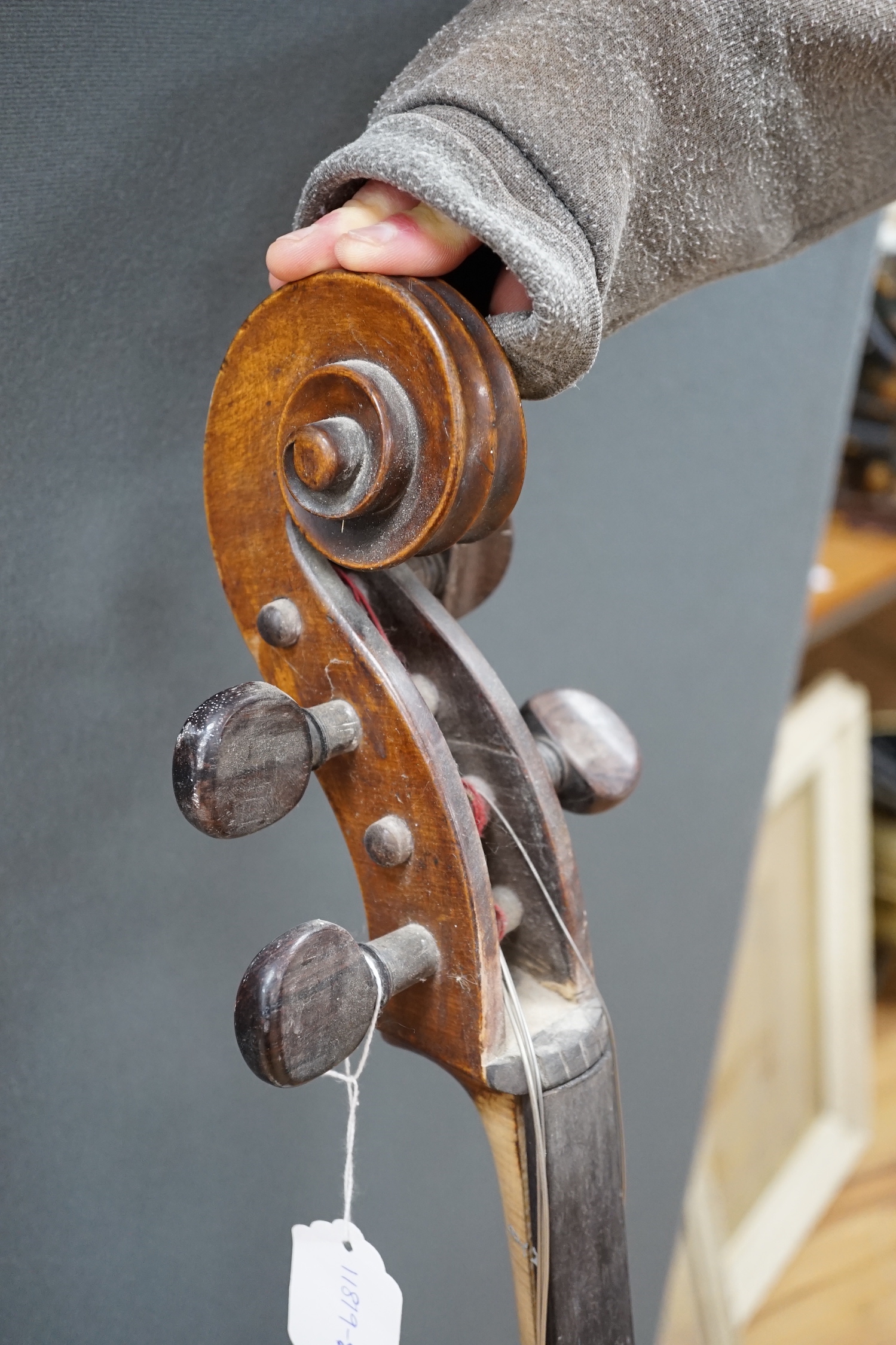 An early 20th century cello for restoration, indistinct internal label; ‘Restored by William J. Acton, Green Street, Forest Gate, London 1910’ length of body 72cm